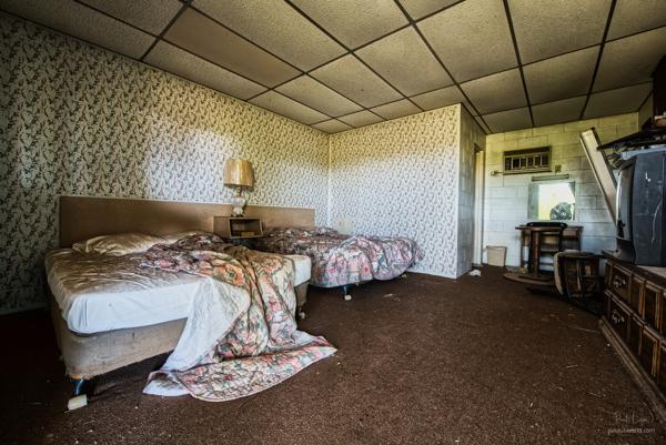 Entering a room in an abandoned motel.